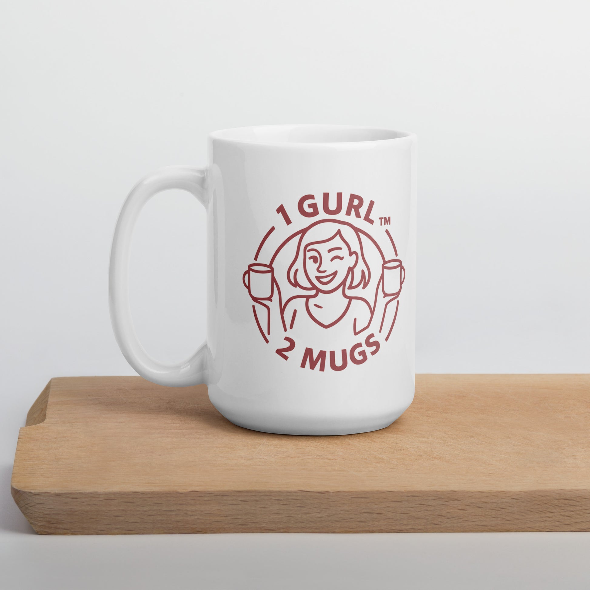 White mug with red logo and text on a wooden surface